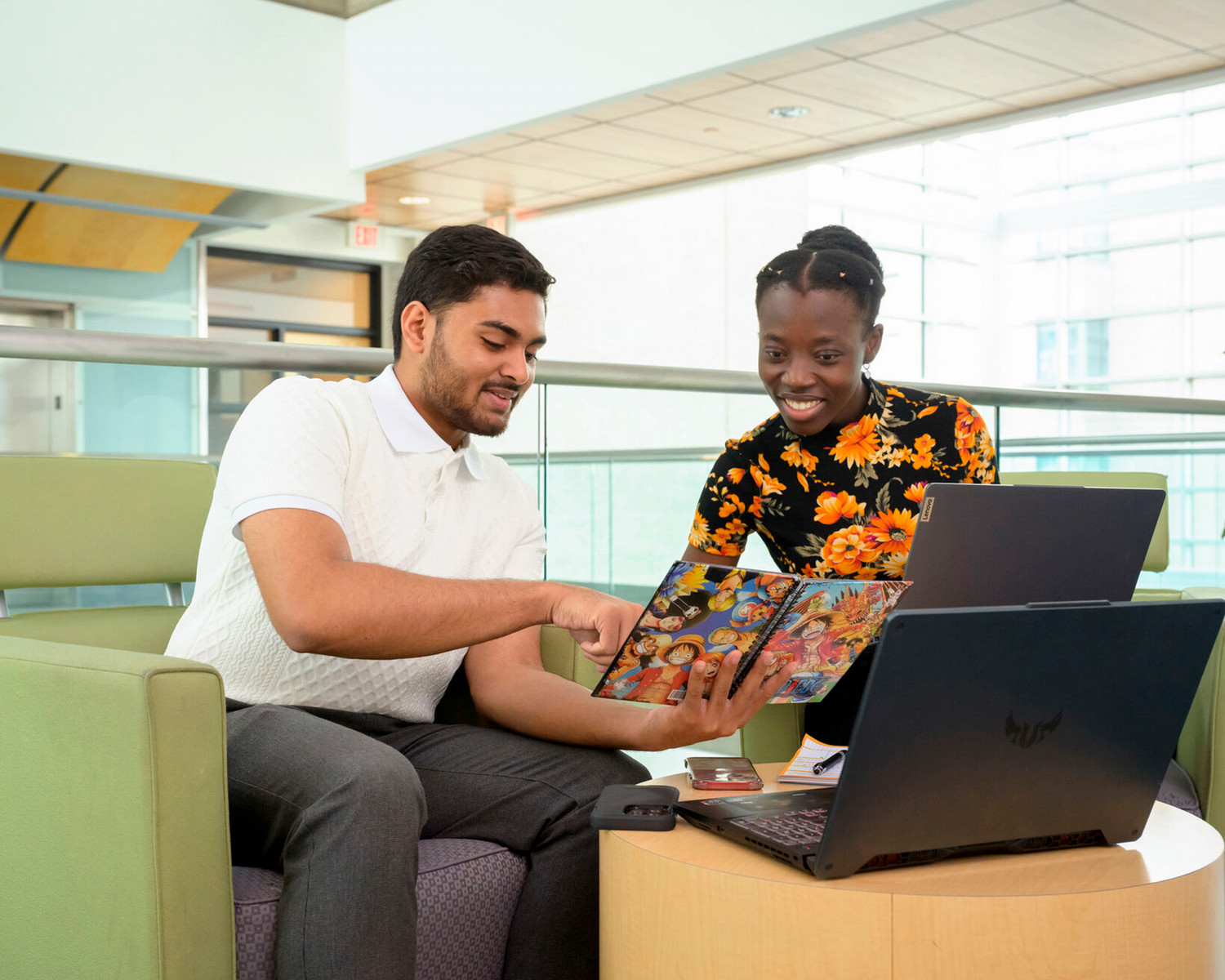 Two people discuss work