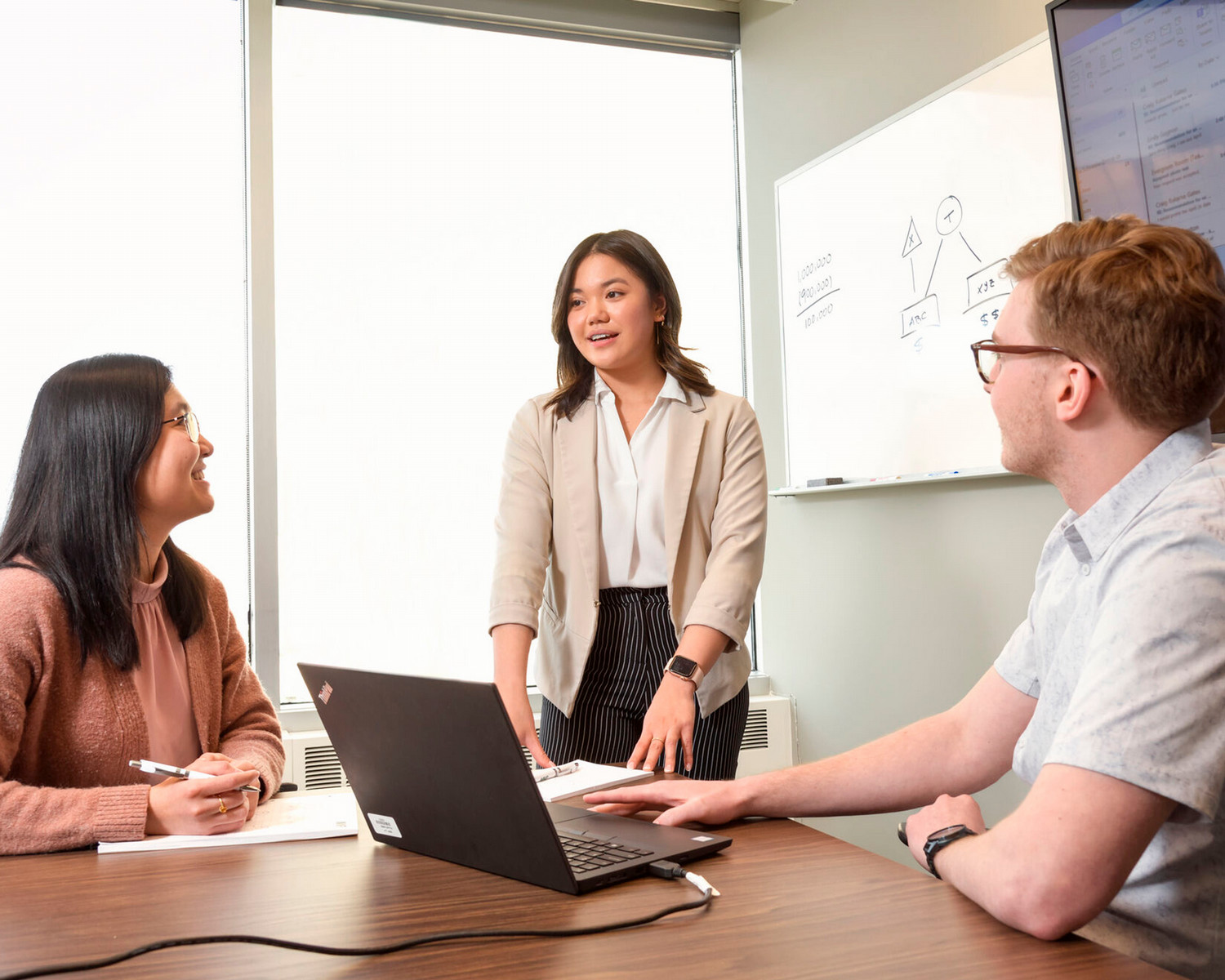 Three people working together at the office