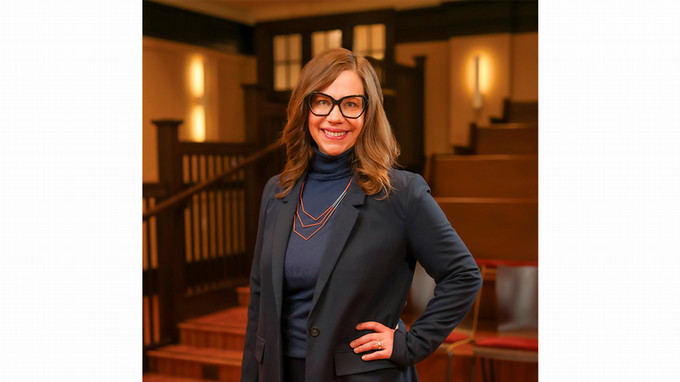 A woman poses for a photo