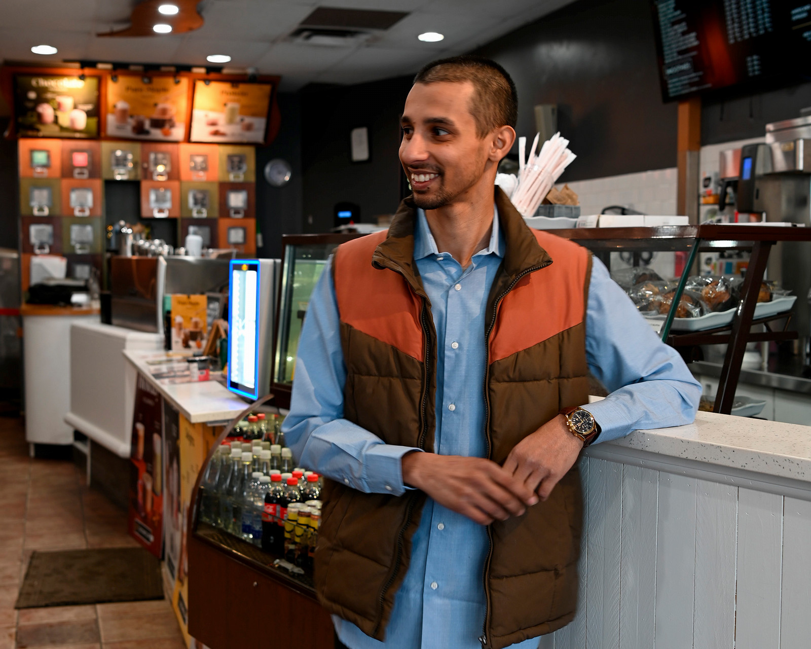 Man smiles at someone off camera