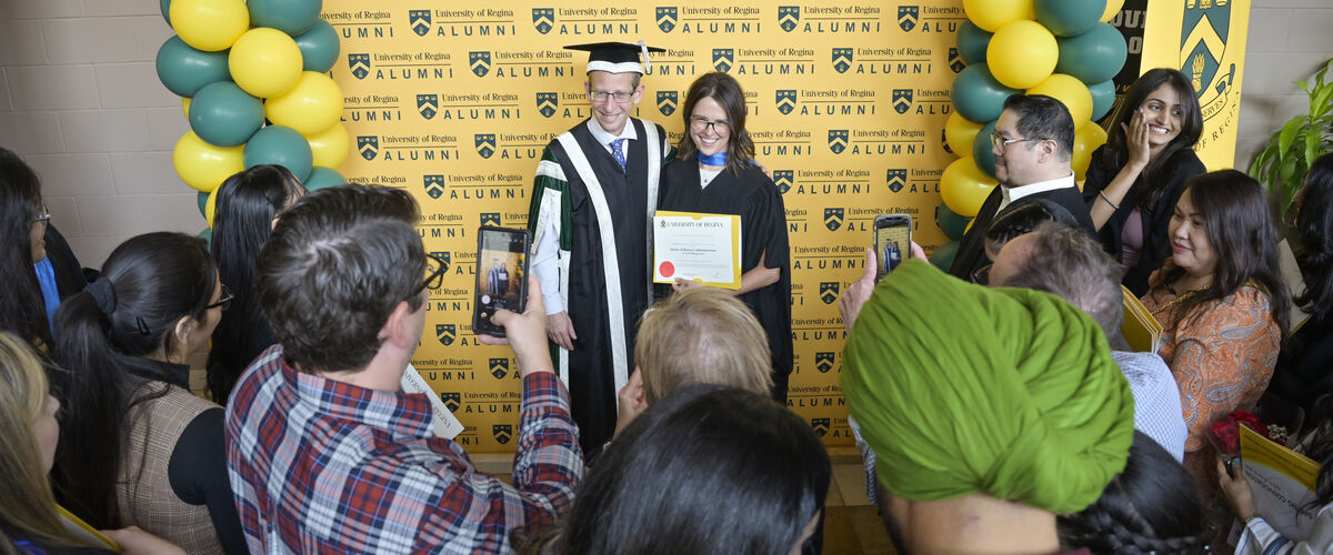 Two students at a convocation ceremony