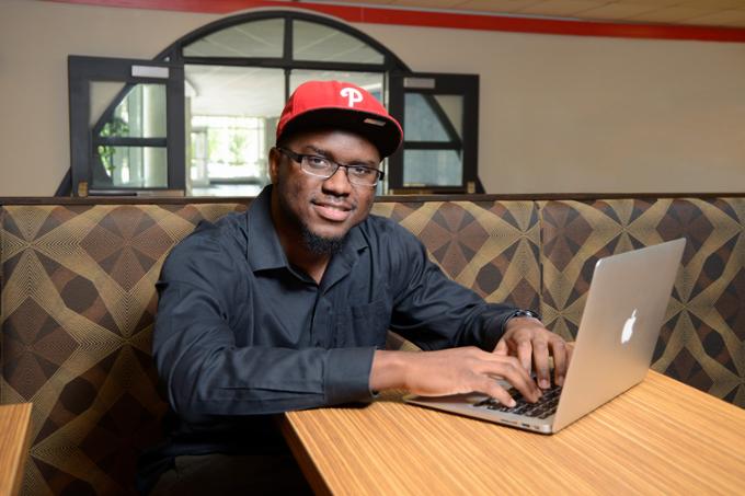 Male student working on a laptop computer in the Lab Cafe