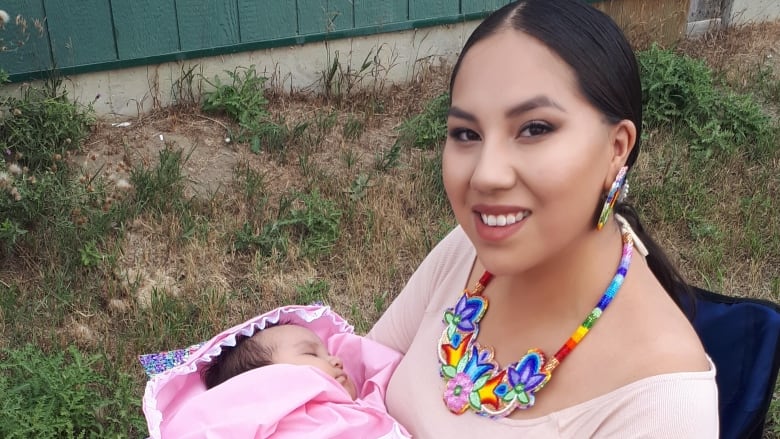 Jolene Creely holding her baby