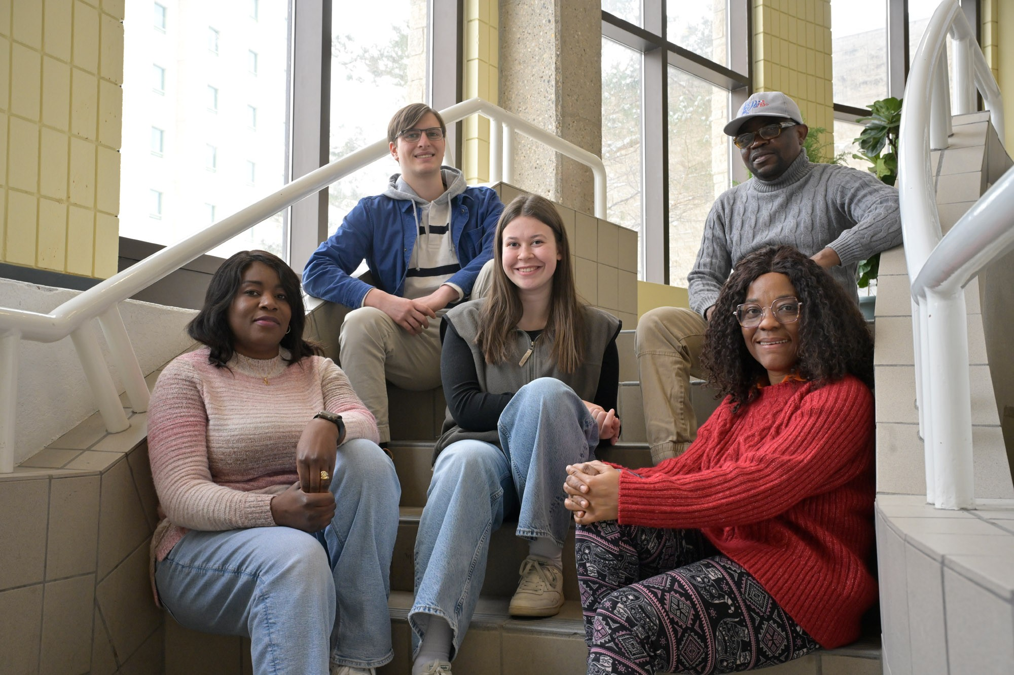 Group of students sitting on stairs