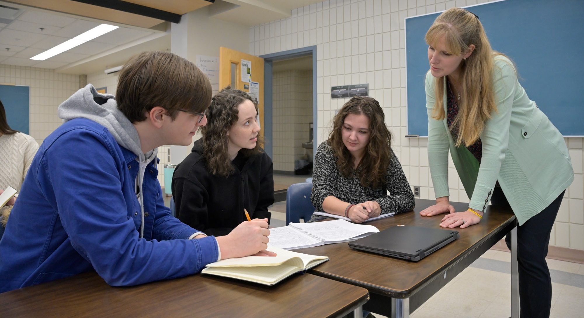 Instructor and students working