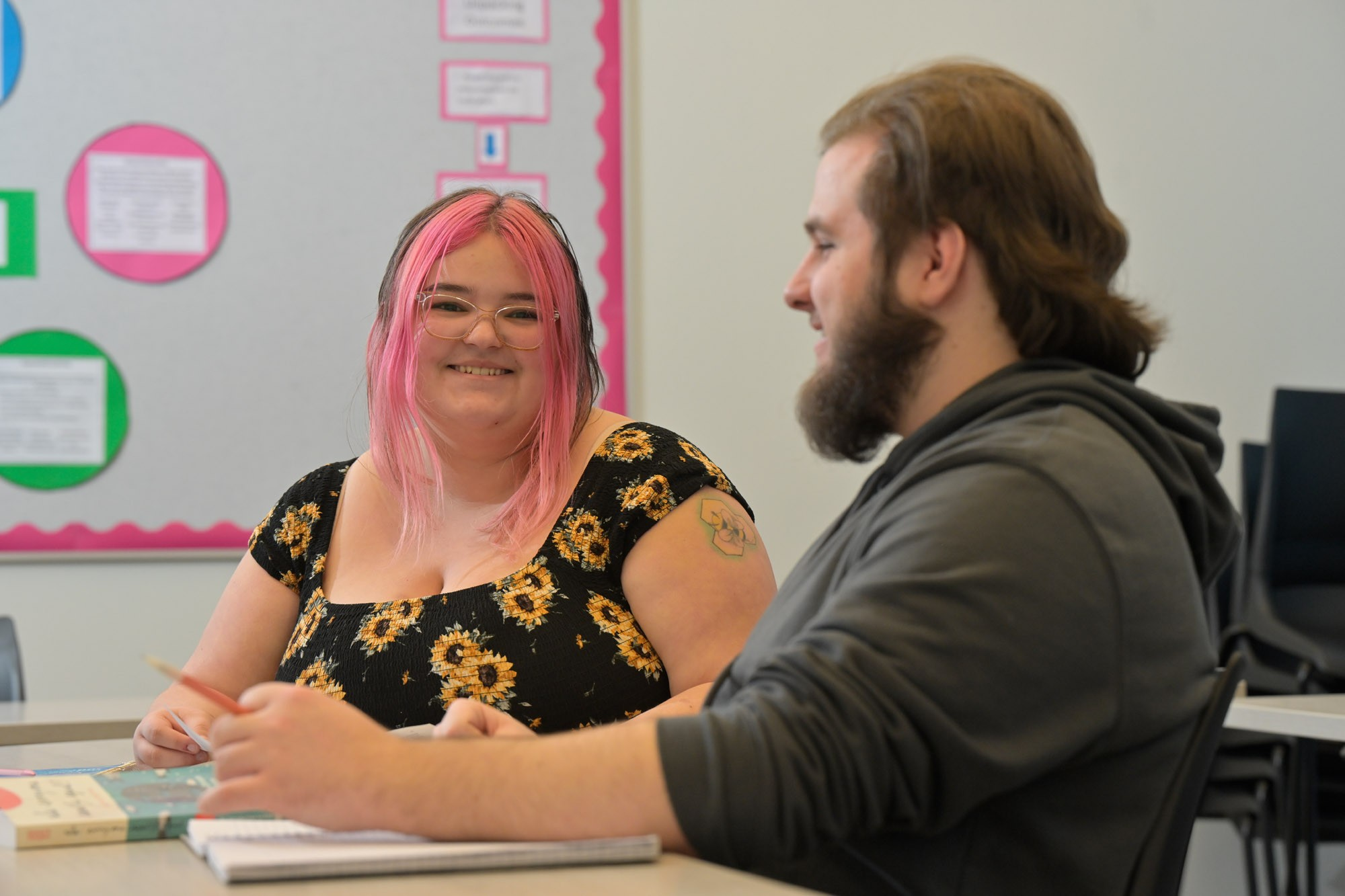 Two students sitting in class