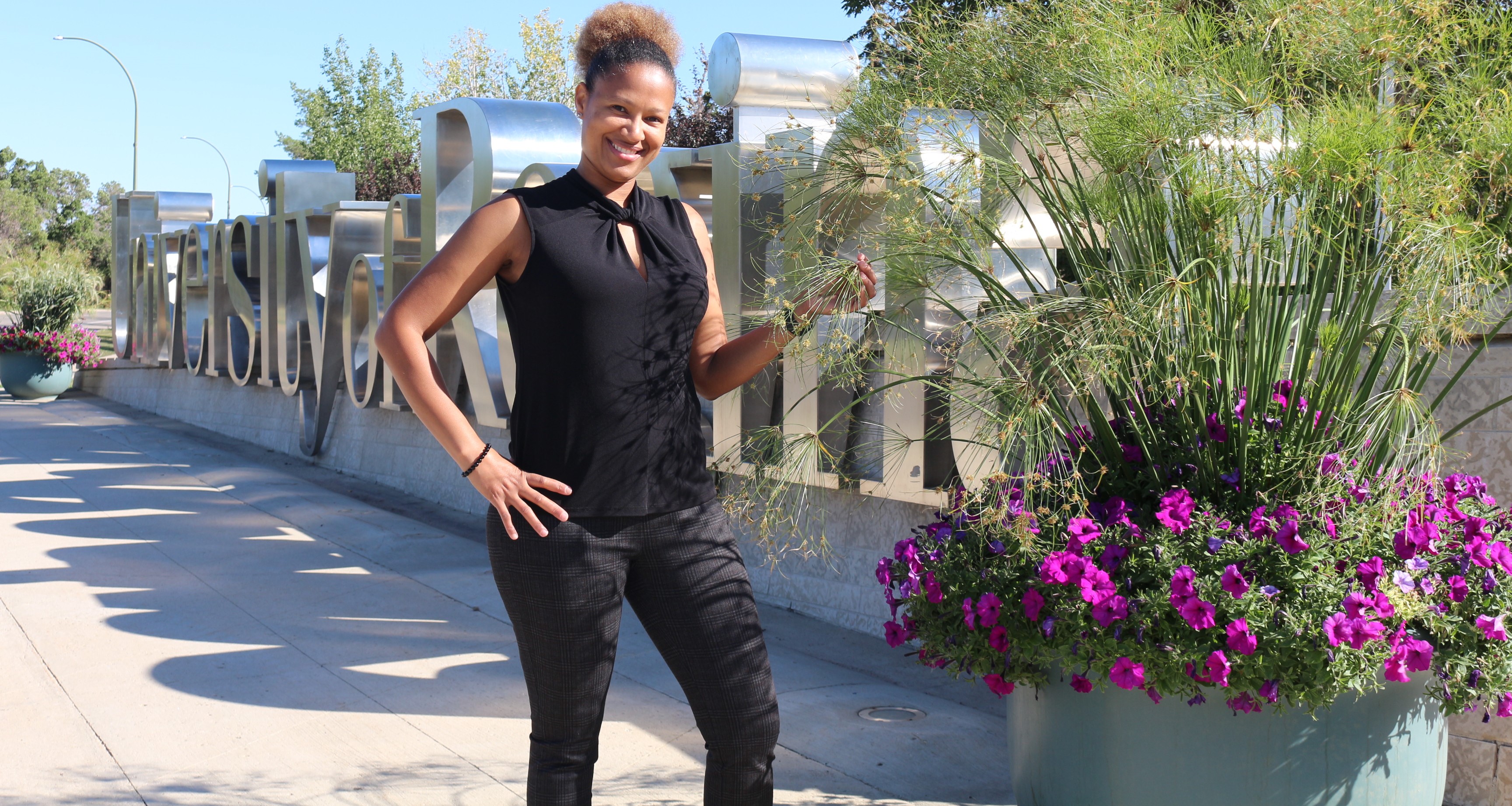A woman poses for a photo