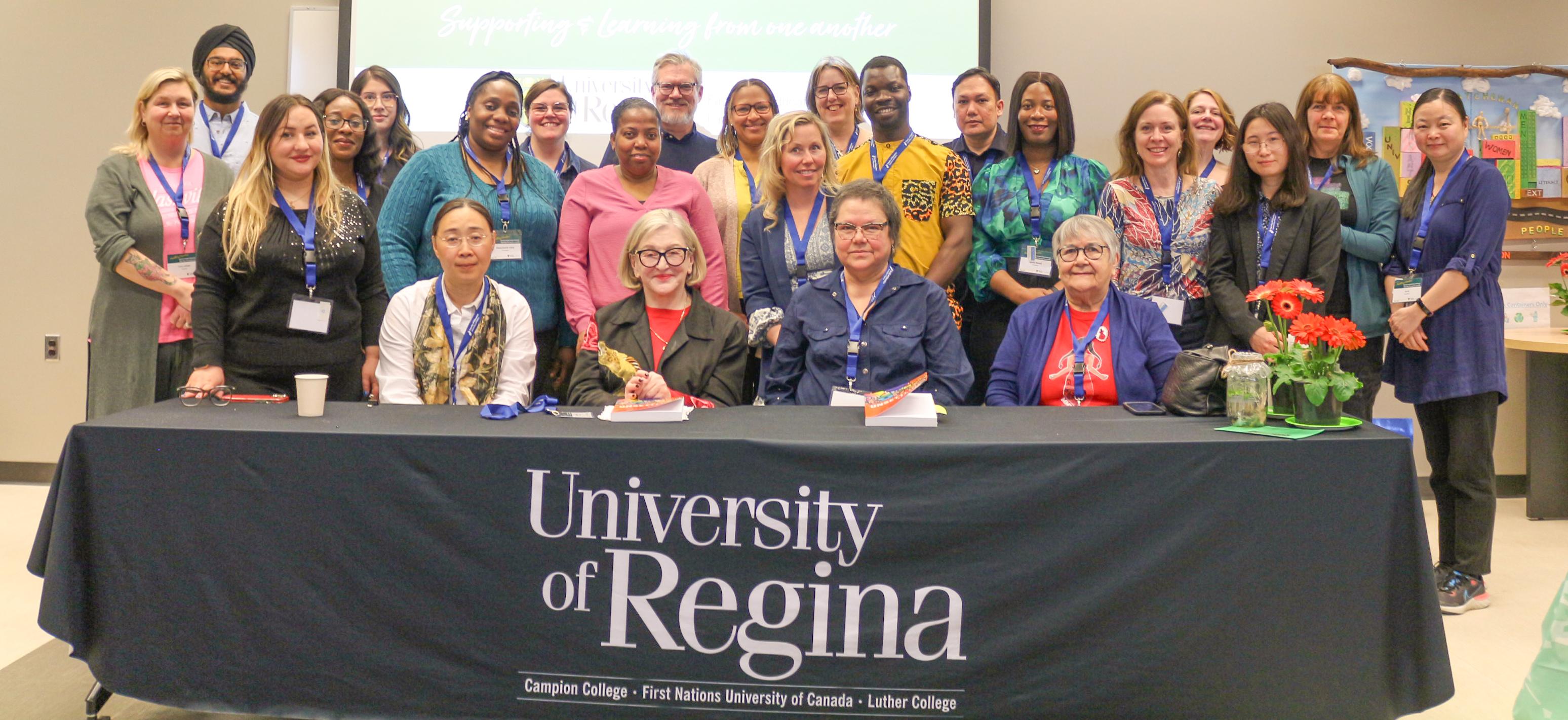 A group of students and professors pose for picture