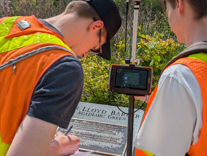 EVSE students using surveying equipment