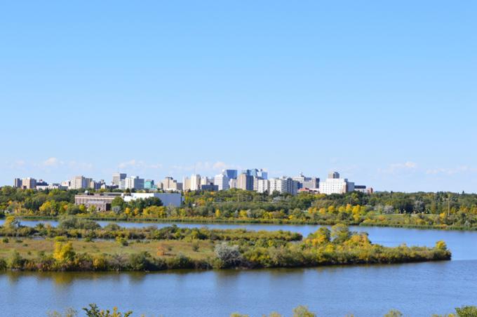 view of Regina skyline from campus looking across Wascana Lake
