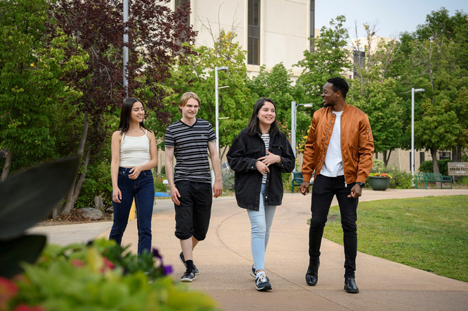 Four people walking and having a chat
