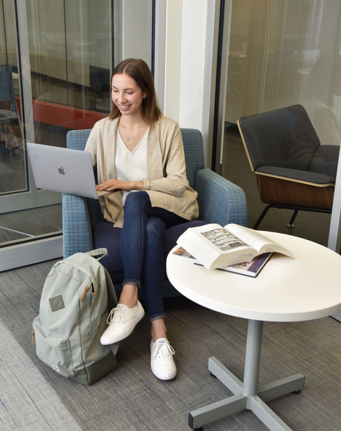 A person sitting with laptop