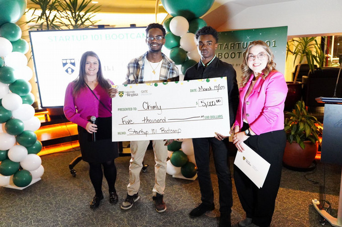 People's choice holding a cheque
