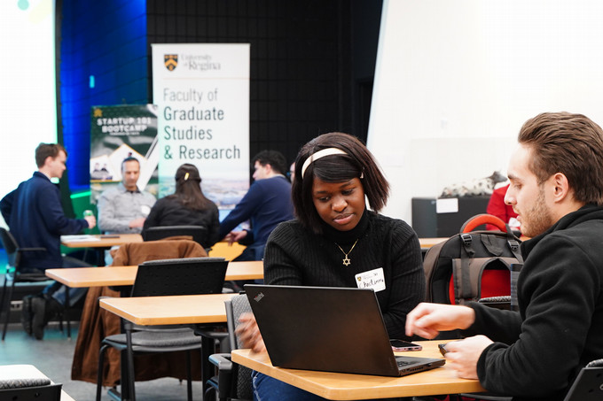 Students looking at computer