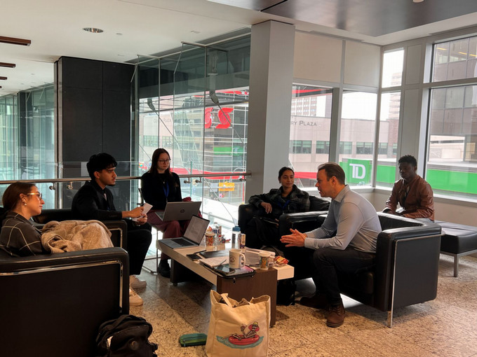 Students talking to mentor