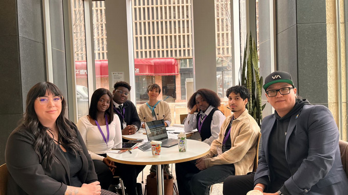 Students talking to mentor