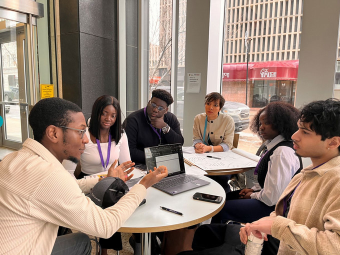 Students talking to mentor