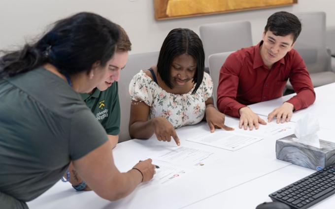 Students reviewing Scholarship applications