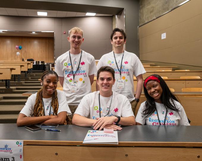 Team 3 poses for a picture before the presentations begin.