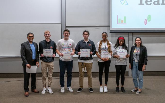 Team 3 poses with their certificates after taking first place. Saqib Khan and Evelyn Cerda are in the picture with them.
