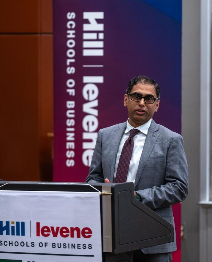 Interim Business Dean Saqib Khan gives greetings.