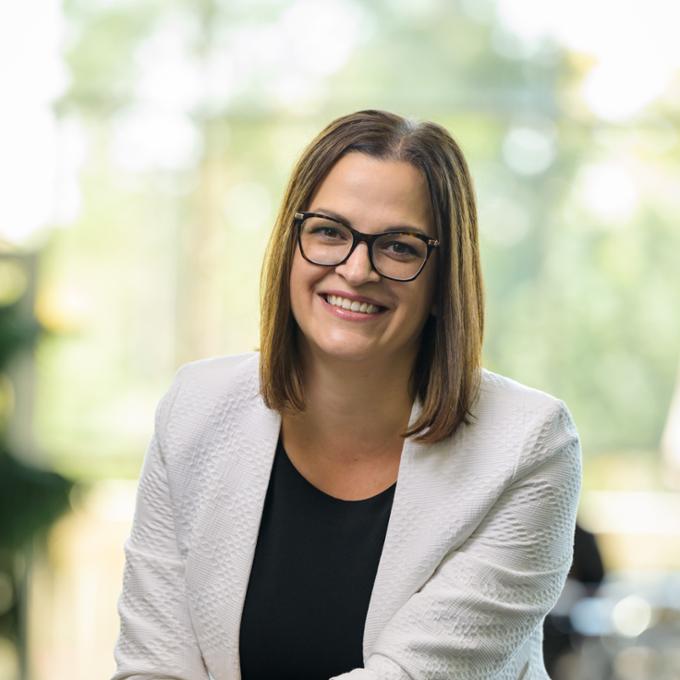 A person sitting and smiling