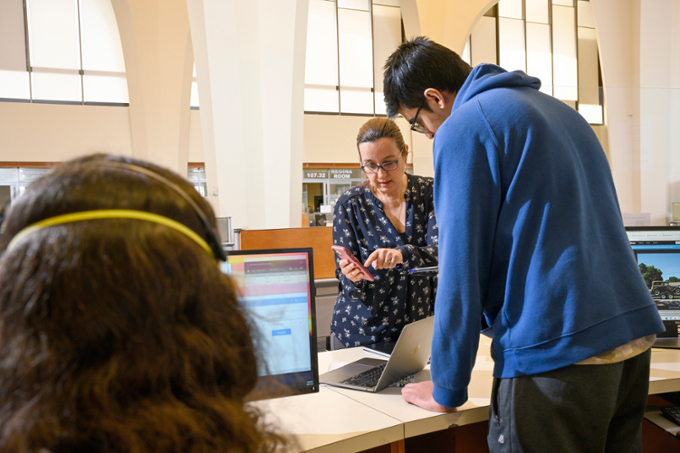 student asking about wifi at IT support in library