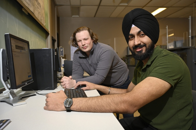 two students working at a computer