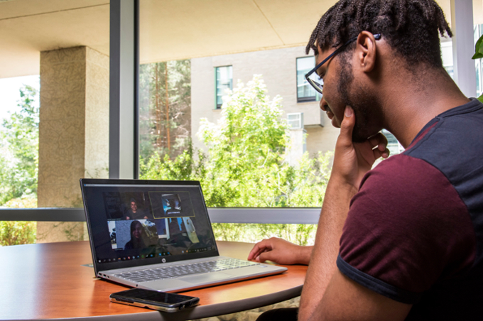 student using zoom on laptop