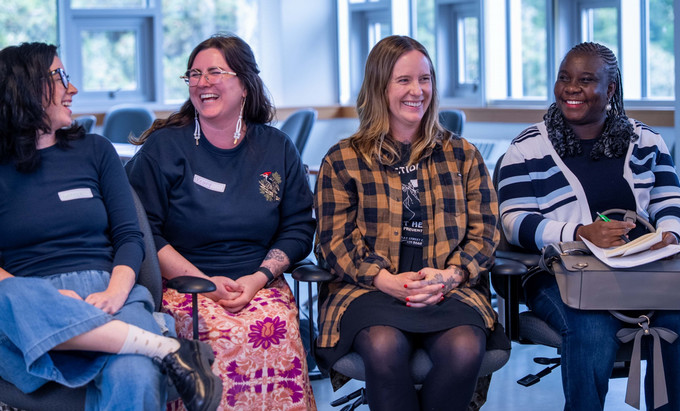 four smiling women