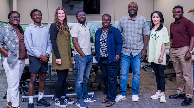 eight smiling people