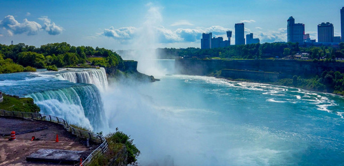 a scenic waterfall and lake