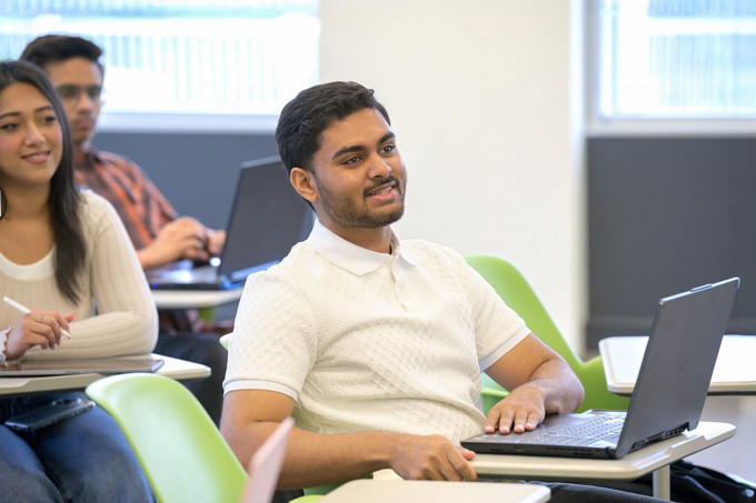 three people in a classroom