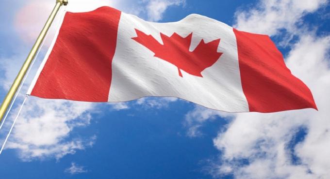 Canadian flag flying on flagpole