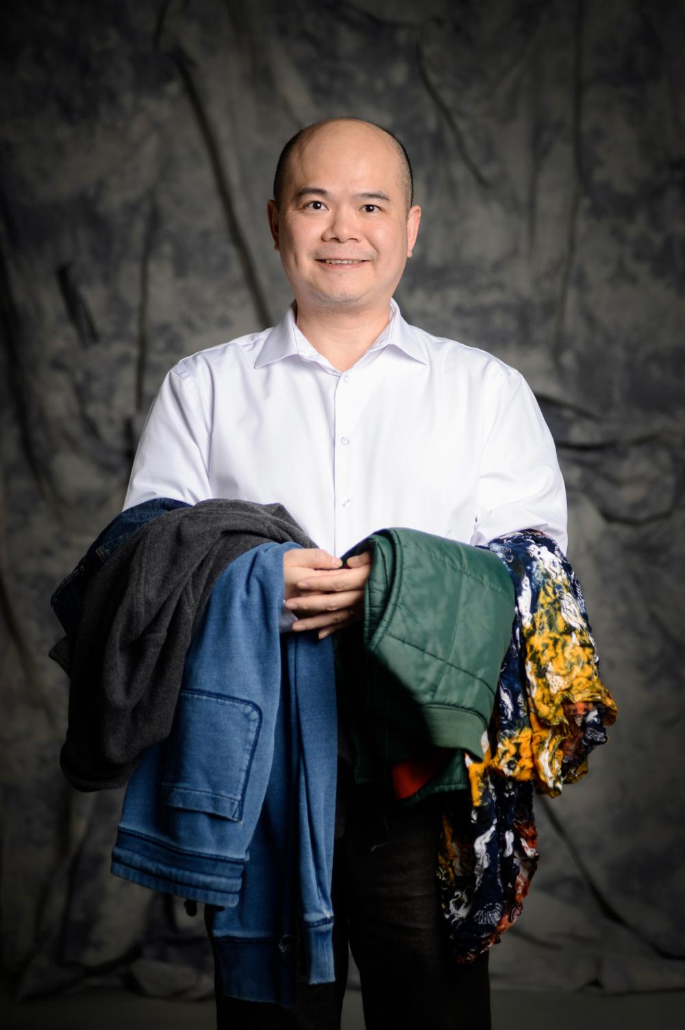 Man holding clothing