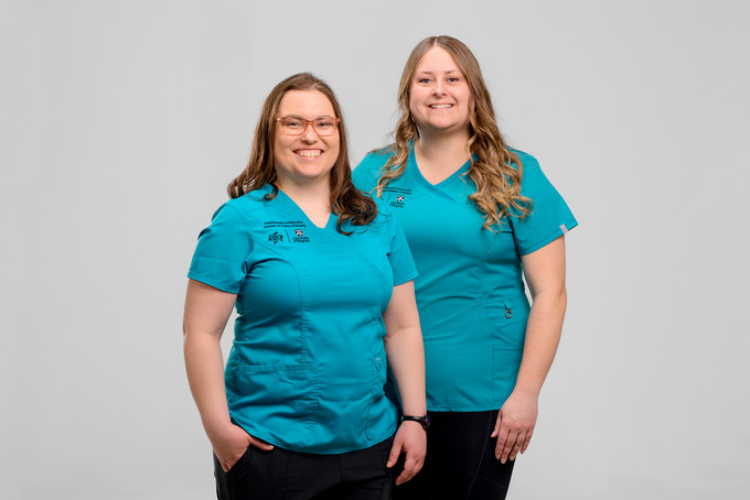 photography of two nursing students in their scrubs