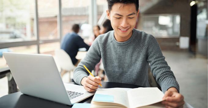 man studying at laptop 