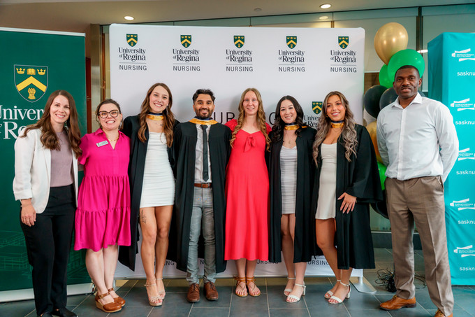  group photo of 5 bilingual nursing graduates and 3 of their instructors. 