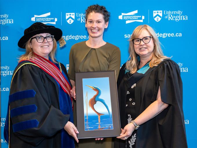 nursing deans presenting deans medal to graduate