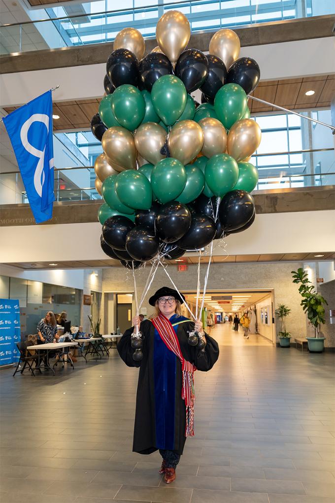 nursing dean with balloon bouquet