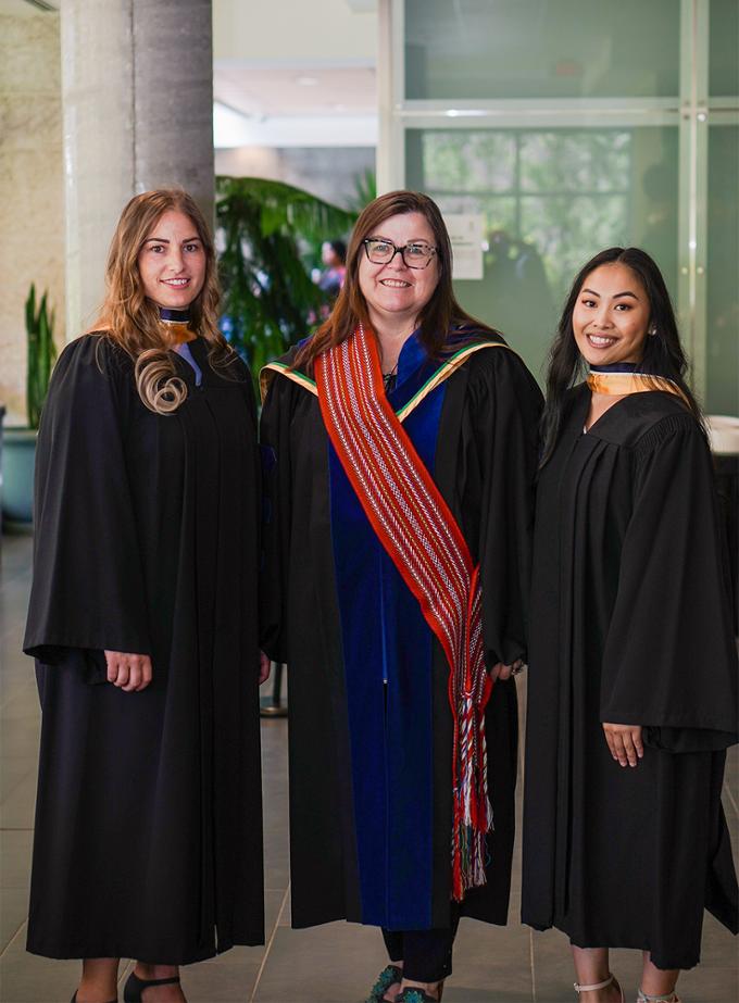 nursing dean with two students at convocation