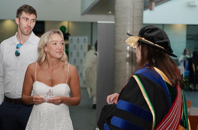 nursing dean speaking with guests at convocation