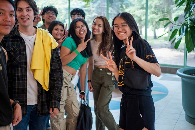 group of people standing and smiling