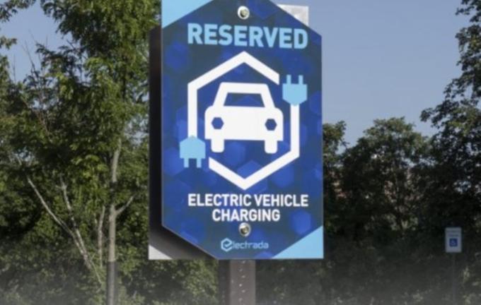 a sign marking a parking spot reserved for electric vehicles
