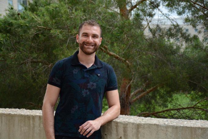 Science Student Standing in Front of Wall