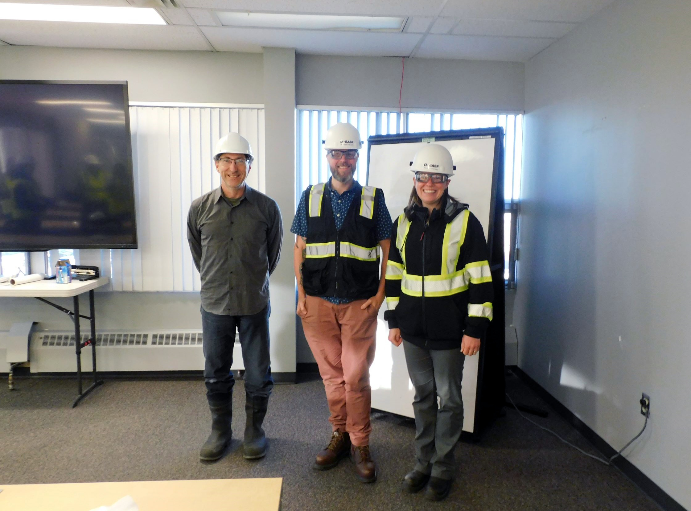 Professor Allan East with two BASF employees and University of Regina alumni.