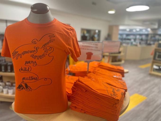 Orange t-shirt display at the U of R Campus Store