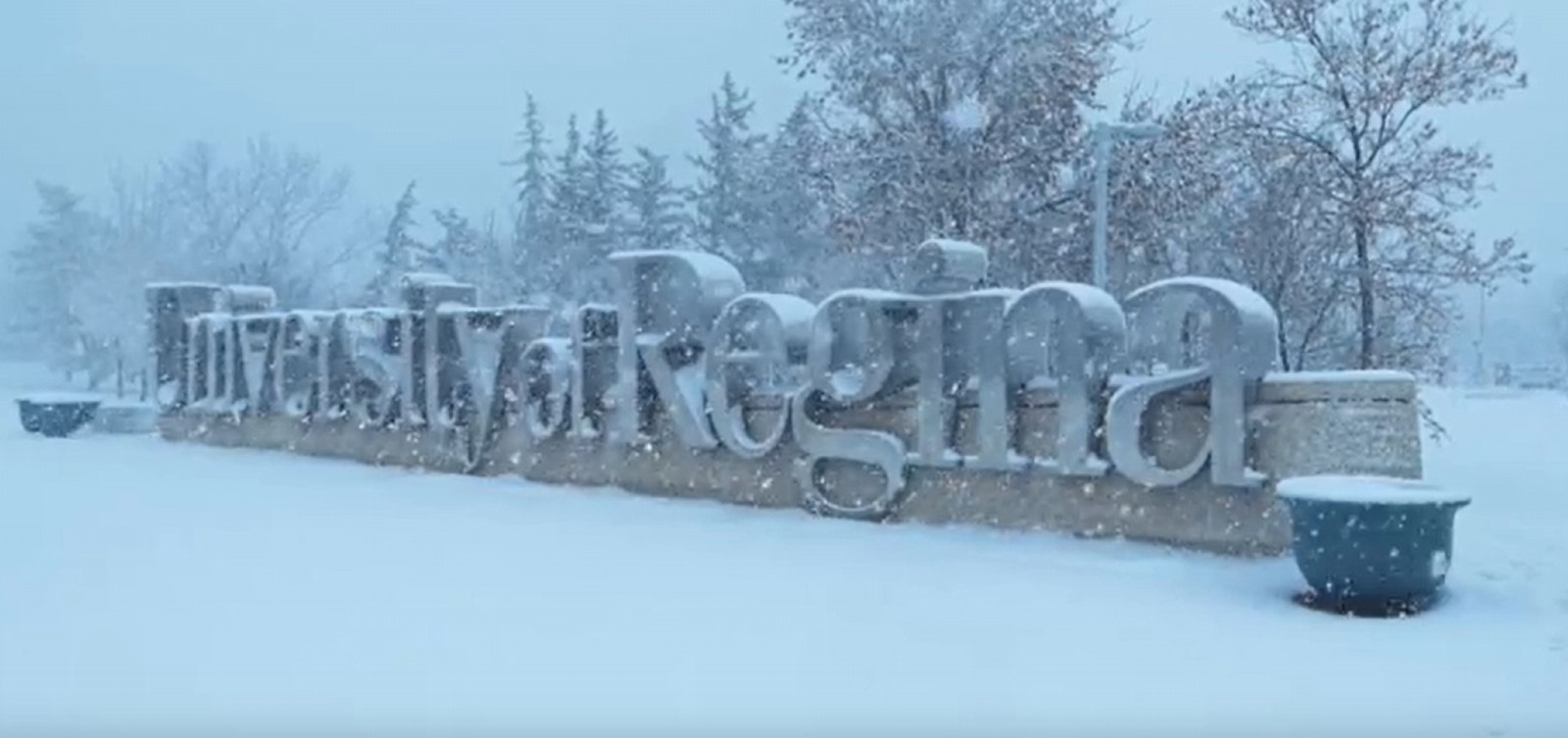 a large U of R sign in the snow