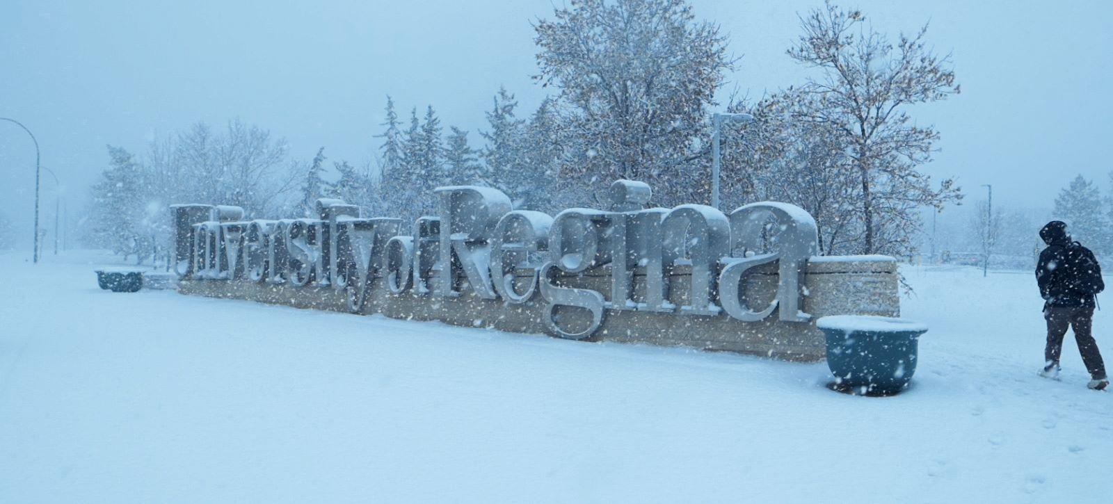 A sign that says University of Regina in winter