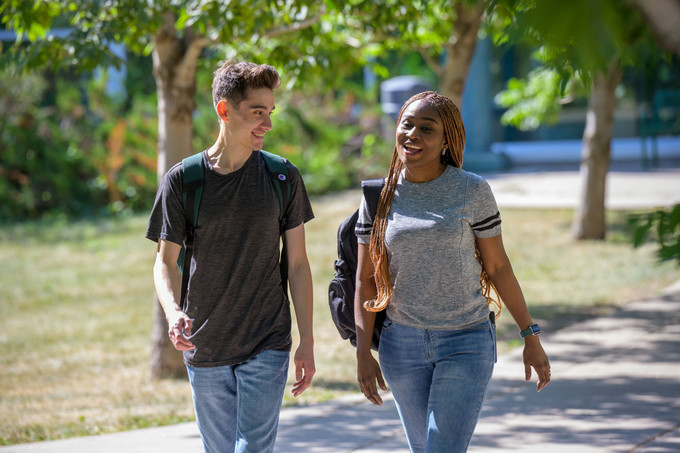 two students with backpacks